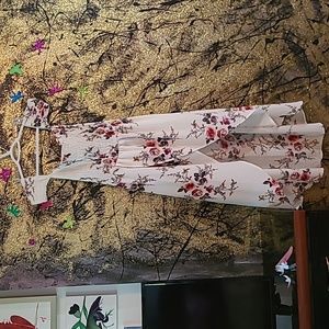 Open fron high low dress. Rose pattern off the shoulder.